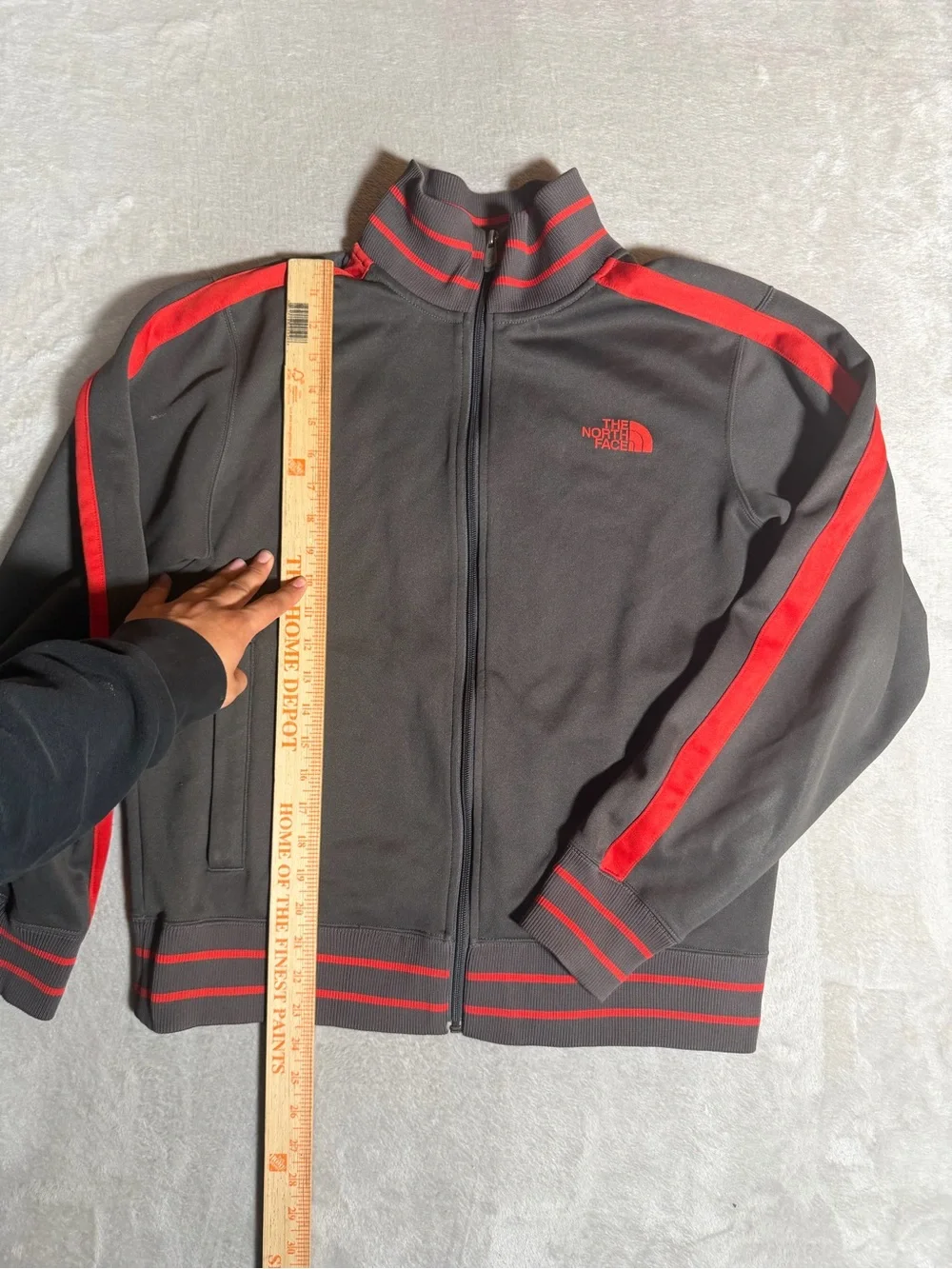 The North Face Black Jacket with Red Stripe Accents